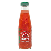 Bang - Sweet Chilli Sauce - 200ml comes in a glass bottle with a green cap and visible chili pieces, making it perfect as a spicy sauce or versatile marinade.